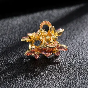 Pince à cheveux fleur dorée avec cristaux roses et strass pour femmes