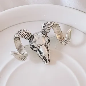 Vintage silver ram skull brooch with spiral horns and detailed antique texture