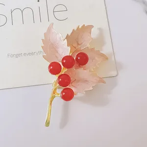 Vintage maple leaf brooch with pink enamel leaves and red pearl berries on gold branch