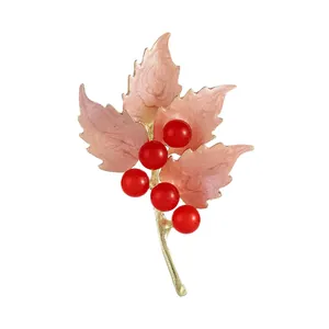 Vintage maple leaf brooch with pink enamel petals and red berries on gold metal base