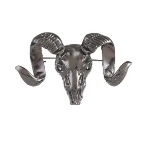 Gothic style ram skull brooch in antique silver finish with detailed spiral horns