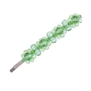 Elegant silver hair clip featuring handcrafted light green crystal flowers in a neat row