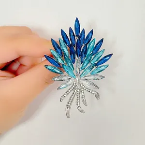 Elegant wheat ear brooch featuring gradient blue marquise crystals on silver metal