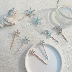 Funkelndes Set aus Strass-Haarspangen mit Stern- und Mondmotiv in Gold und Silber