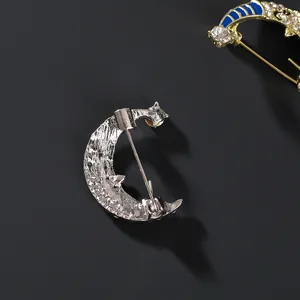 Smiling crescent moon brooch with blue enamel and sparkling crystal rhinestones