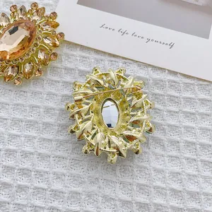 French vintage sunflower brooch with green crystal and champagne amber stone centerpiece