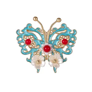 Eleganter Schmetterlings-Brosche mit blauer Emaille und roten Perlen für Kleidung