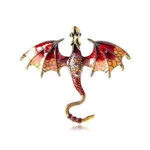 Detail of vintage dragon brooch with colorful enamel wings and sparkling rhinestones