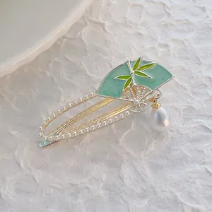 Chinese style bamboo leaf fan hair clip with green enamel and white pearls in gold finish