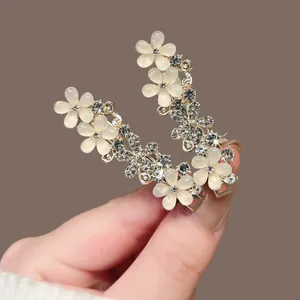 Barrettes à cheveux fleurs œil de chat élégantes avec strass brillants dorés
