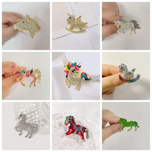 Detailed grid of colorful enamel and rhinestone horse and unicorn brooch pin collection