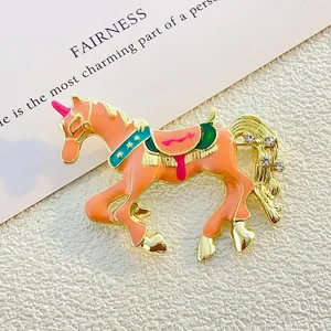 Exquisite unicorn carousel brooch with pink enamel and sparkling rhinestones