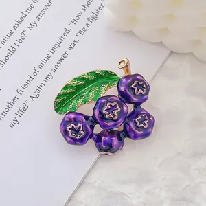 Artistic gold-plated blueberry brooch with green leaves and purple enamel fruit clusters