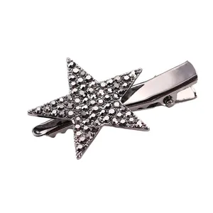 Fashionable star-shaped hair clip with grey rhinestones on dark silver metal base