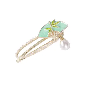 Elegant Chinese style gold bamboo leaf fan hair clip with white pearls and green enamel