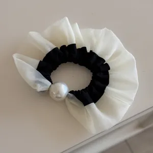 Elegant black and white organza scrunchie with a large pearl detail in a chic Korean style