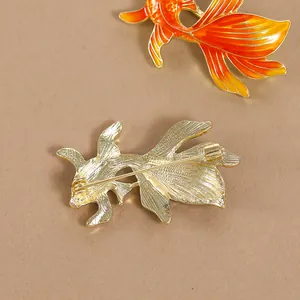Elegant gold-plated koi fish brooch with orange enamel gradient in Chinese style