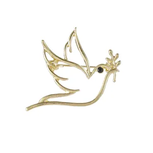 Minimalist hollow gold peace dove brooch with olive branch and black zircon eye detail