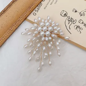 Handcrafted vintage gold pearl brooch with floral clusters and hanging tassels