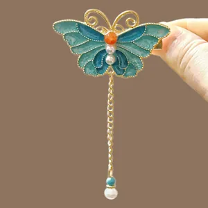 Elegant blue butterfly hair clip with gold fringe tassels and white pearls