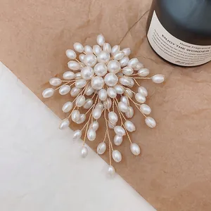 Handcrafted pearl cluster brooch with gold wire weaving and elegant floral design