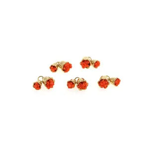Macro shot of 10-piece zircon-encrusted rose gold floral pendants on white background