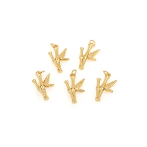 Macro detail of five 18K gold plated bamboo leaf charms with cubic zirconia for DIY jewelry