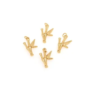 Set of four 18K gold-plated bamboo pendants with zircon accents on white background