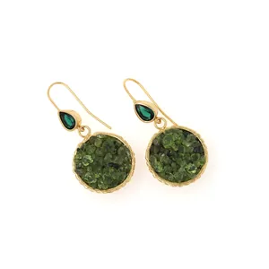 Detail of 18K gold-plated drop earrings featuring green stones and raw crystal inlay