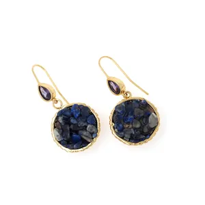 Macro shot of 18K gold plated earrings featuring lapis lazuli and purple zircon stone