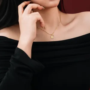 Detail of S925 silver gold necklace with zircon rectangle pendant and Chinese character
