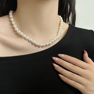 Close-up of elegant 925 silver pearl necklace on a model showing natural luster and texture