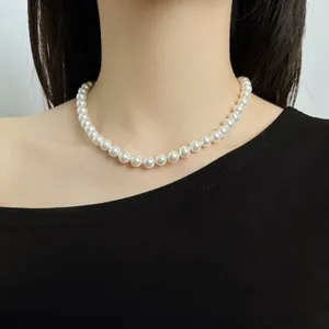 Close-up of elegant S925 silver white pearl necklace worn on model's neck for a classy look