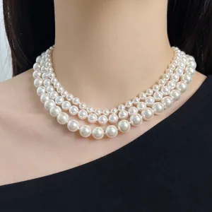 Three-layer S925 sterling silver pearl necklace with elegant white round beads on model