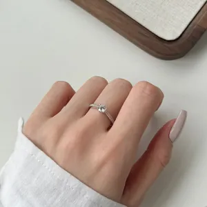 Classic S925 sterling silver six-prong diamond ring shown on female model hand