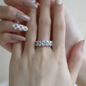 Detail of S925 sterling silver ring with oval-cut cubic zirconia in a paved setting