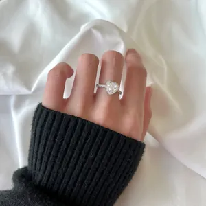 Elegant s925 silver heart shaped zircon halo ring with pave setting on model hand