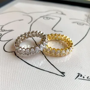 Elegant s925 silver eternity rings with oval-cut cubic zirconia in gold and silver finish