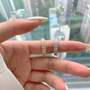 Detailed view of gold and silver S925 sterling silver rings with oval-cut cubic zirconia