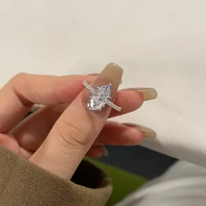 Marquise-cut high carbon diamond ring in S925 sterling silver held by hand