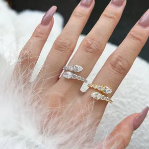 Detail of adjustable S925 sterling silver bypass rings with pear-cut cubic zirconia