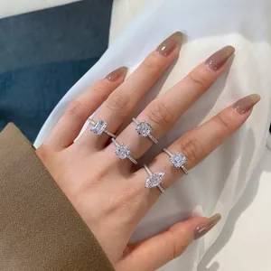 Detailed view of five S925 silver rings with emerald, round, and marquise cut stones