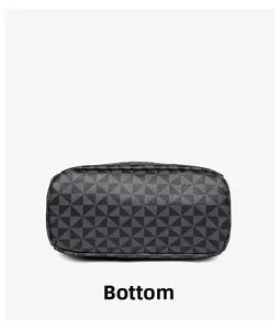 Detailed bottom view of deep grey geometric pattern backpack showing wide flat base