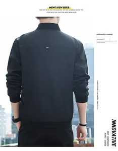 Detail view of men's black bomber jacket with ribbed cuffs and back seam design