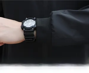 Close-up of elastic ribbed cuffs on a black bomber jacket showing textile texture