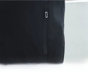 Detailed close-up of a black casual jacket showing a vertical zipper pocket with white puller