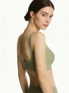 Detail of olive green seamless sports bra with wide straps and deep U-shaped back design