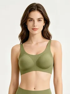 Macro detail of seamless grass green sports bra with wide ribbed hem and U-neckline