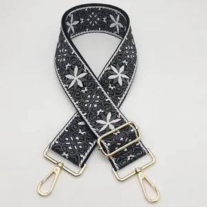 Ethnic style embroidered bag strap in black and white with gold metal swivel hooks