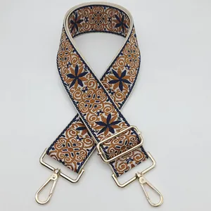 Ethnic embroidered bag strap in dark blue and brown with gold metal lobster clasps